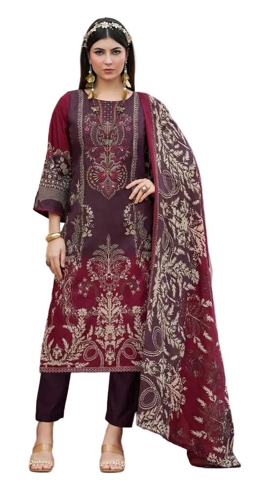 Woman wearing a maroon embroidered outfit with a matching dupatta
