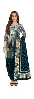 Woman wearing a green embroidered saree with matching dress and dupatta