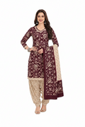 Woman wearing a maroon and beige traditional outfit with a matching dupatta
