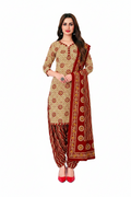 Woman wearing a traditional outfit with red and beige patterns